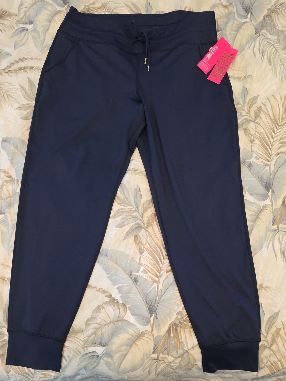 Women's navy jogger by Lilly Pulitzer. Slight satin finish, stretchy high waist.